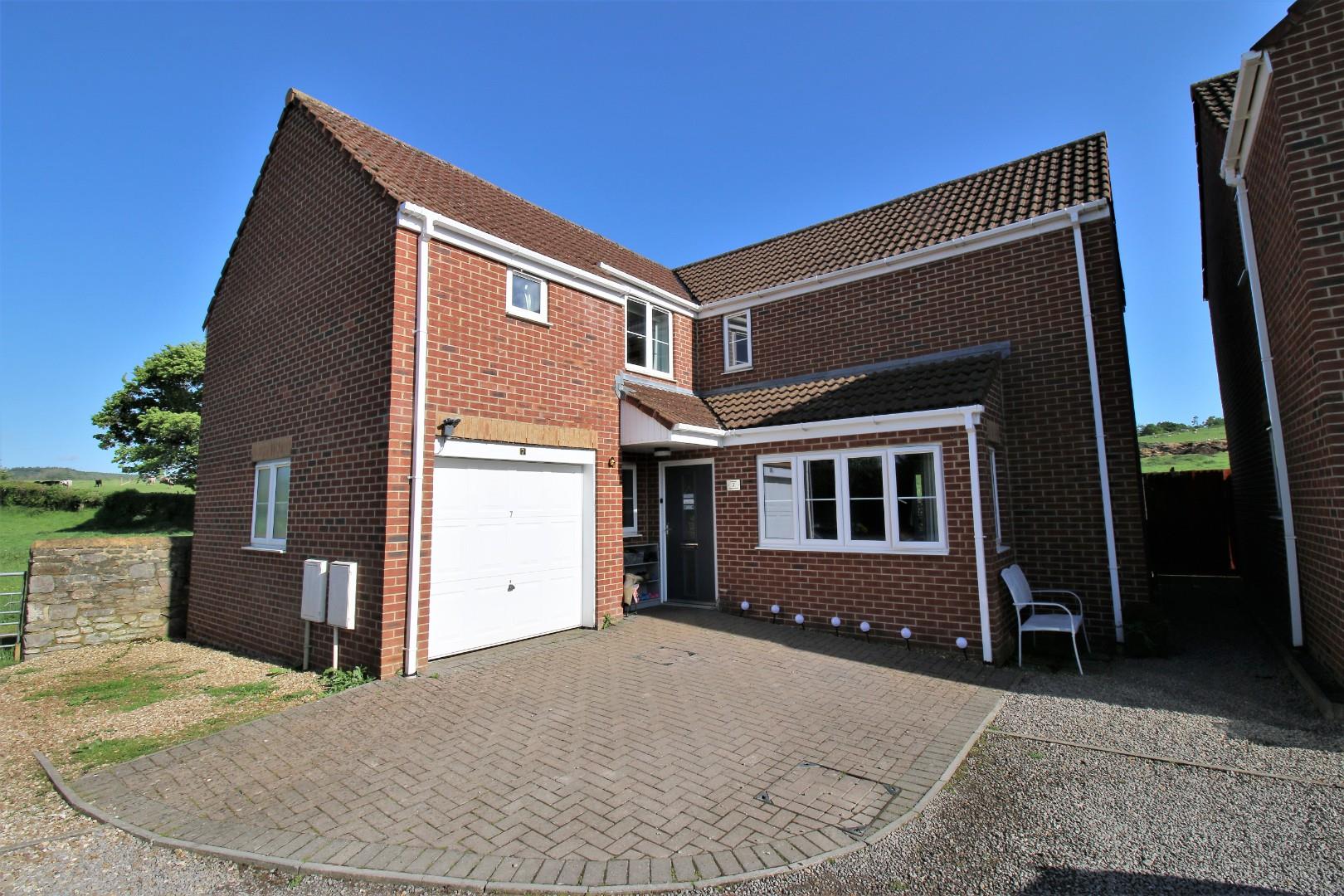 Family home backing onto farmland in the village of Claverham