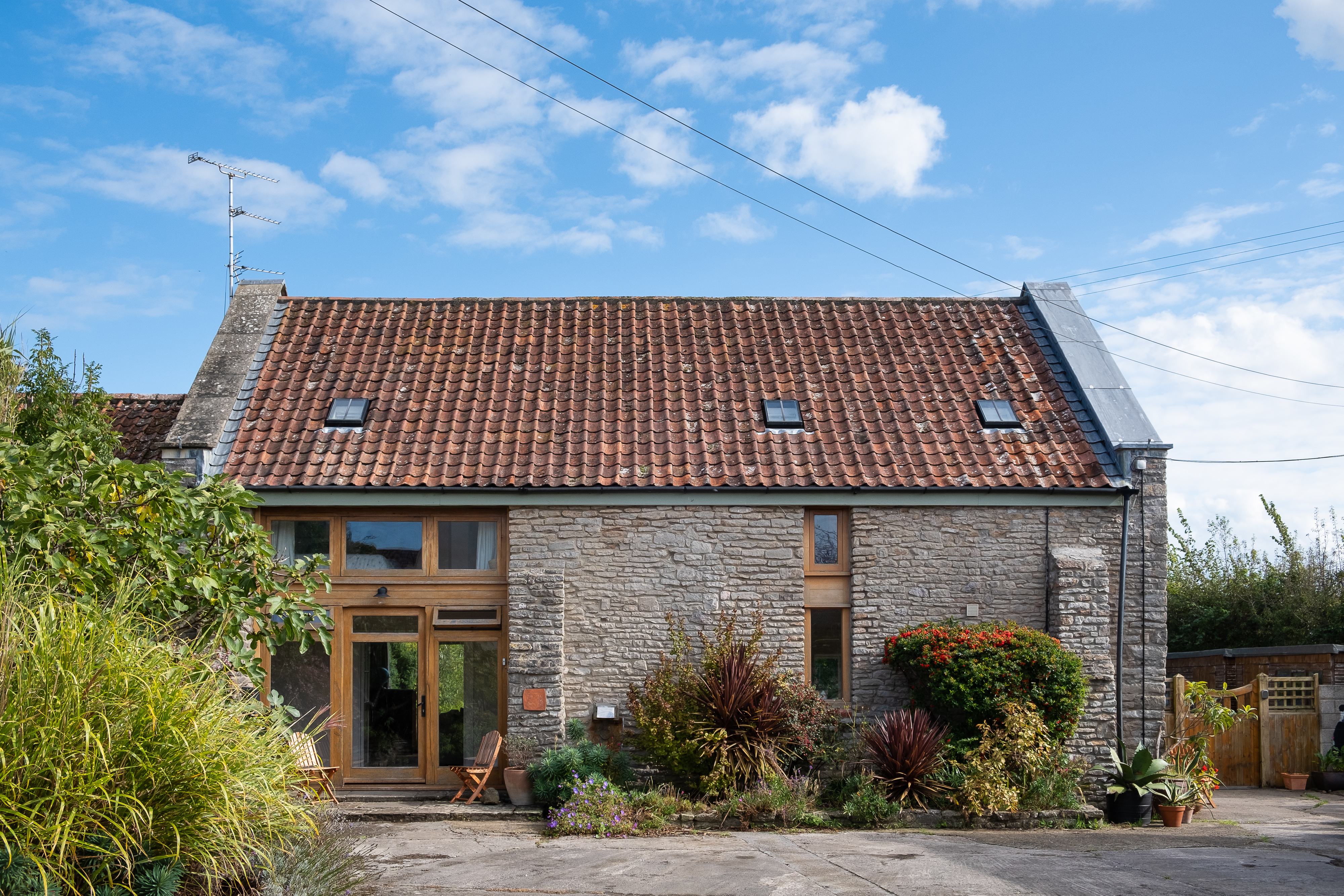 Converted barn with outbuilding and bungalow